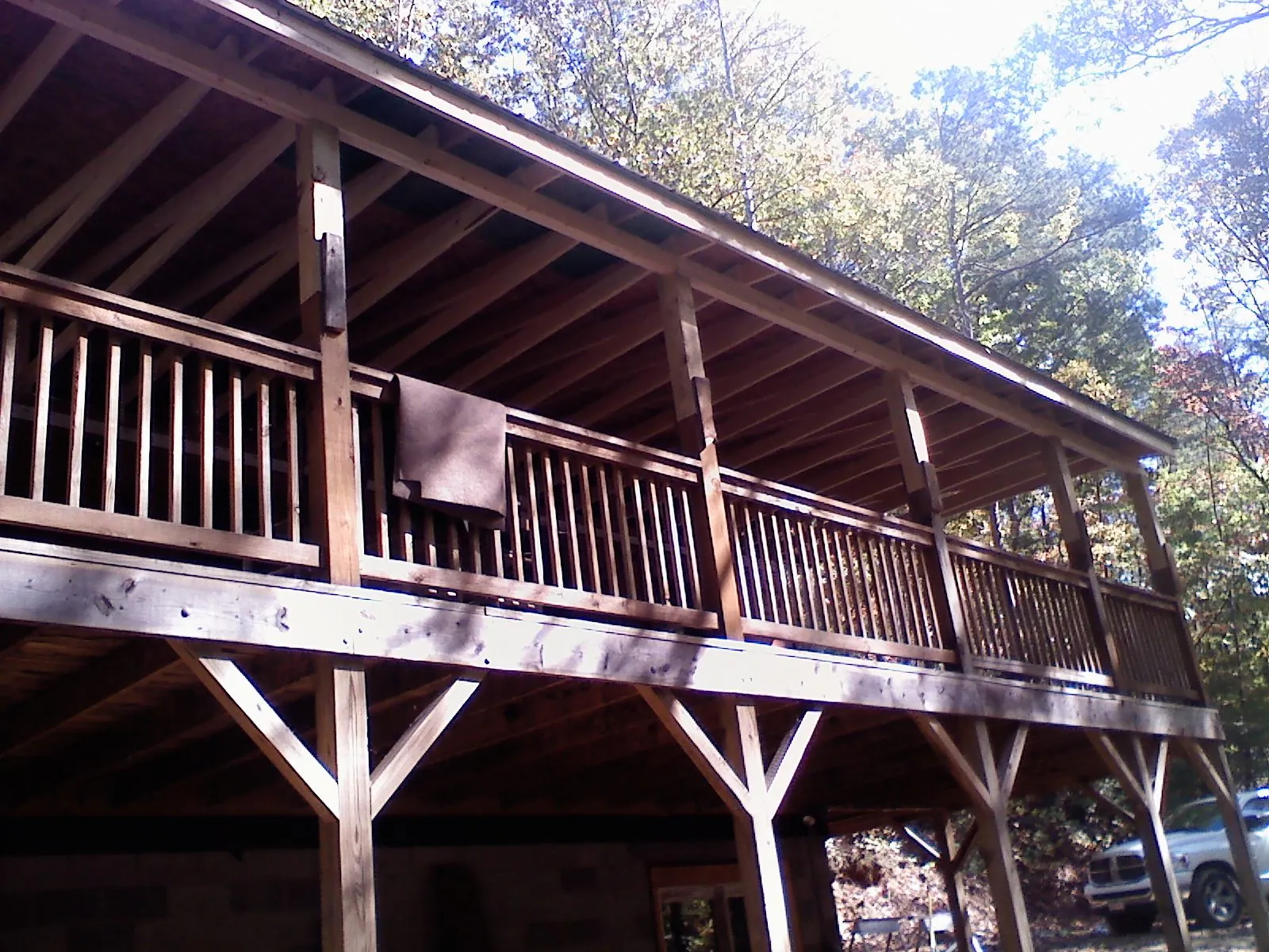 Timber framing under a new elevated porch and deck — Roof Leak Repair in Grand Forks Afb by Roofing Brothers